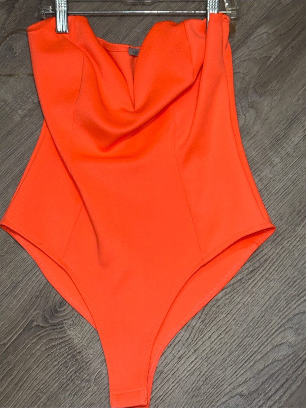 Neon orange strapless body suit